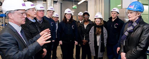 Colin Baines speaks with the President of The University of Manchester, Professor Dame Nancy Rothwell, and the apprentices.